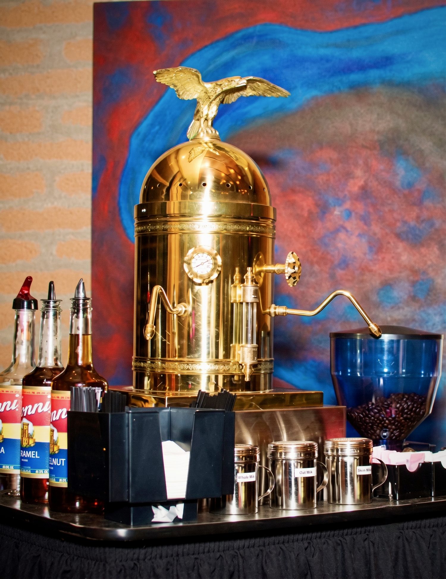 The Dome, a vintage copper and brass espresso machine, set up at an event